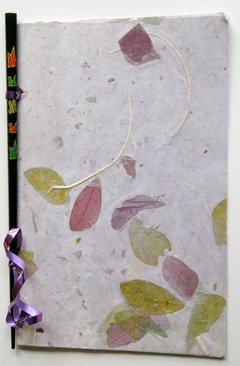 Book made with chopstick, ribbon, handmade leaf paper